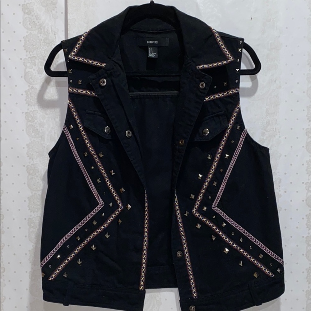 Black denim vest with studs